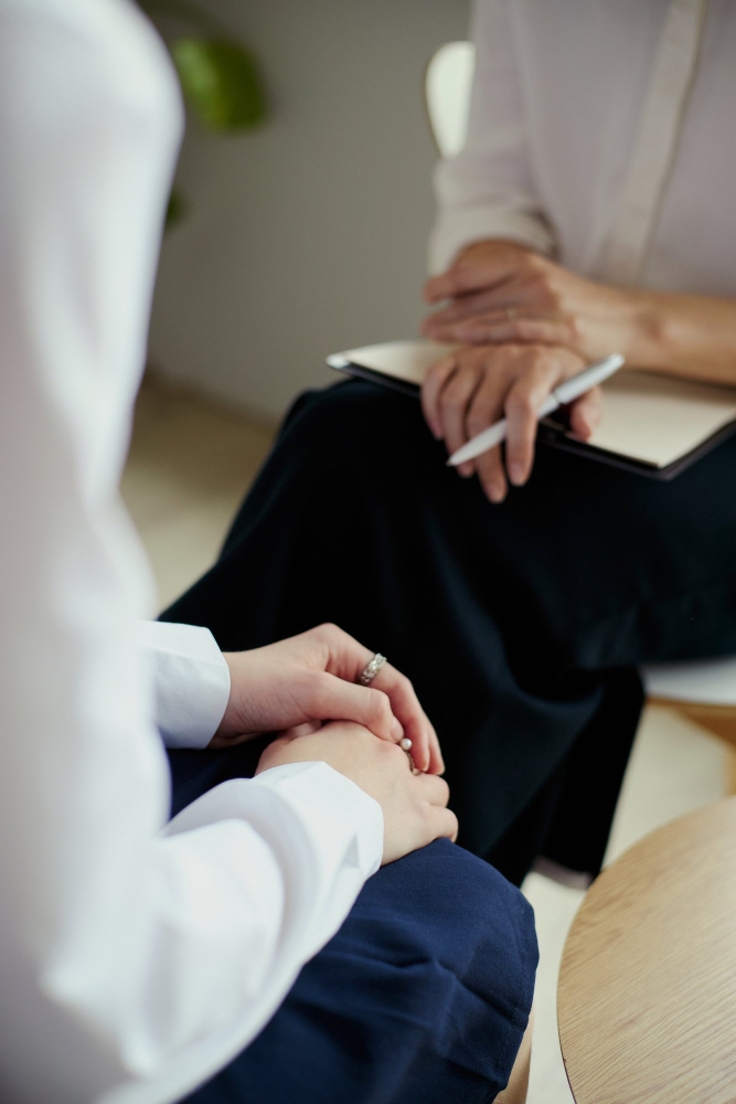 Adult woman participating in a supportive therapy session as part of an IOP in Hanover, MA.