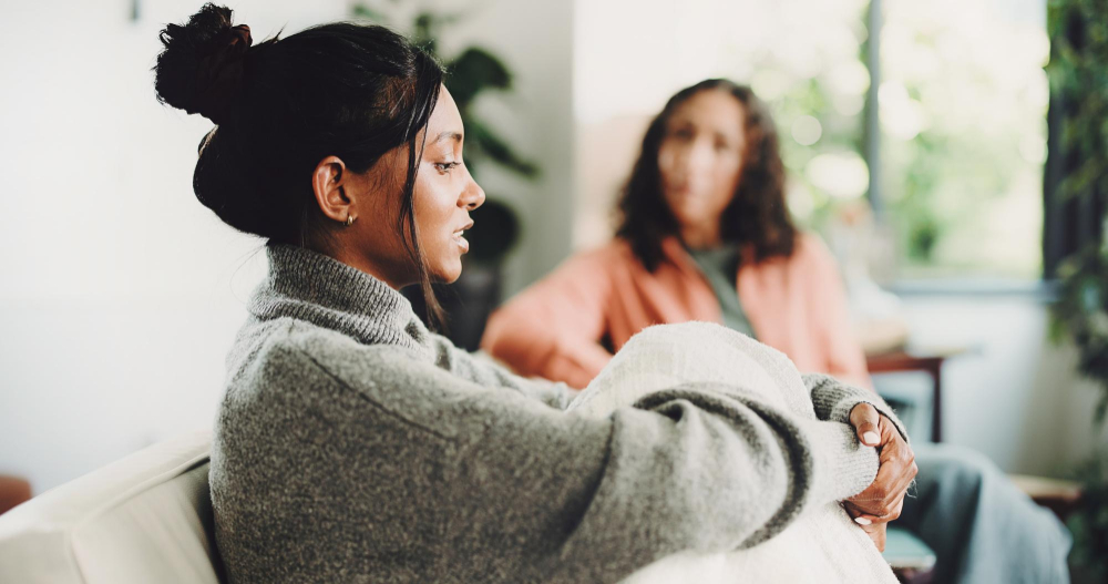 Psychologist counseling a woman during an IOP in Hanover, MA.