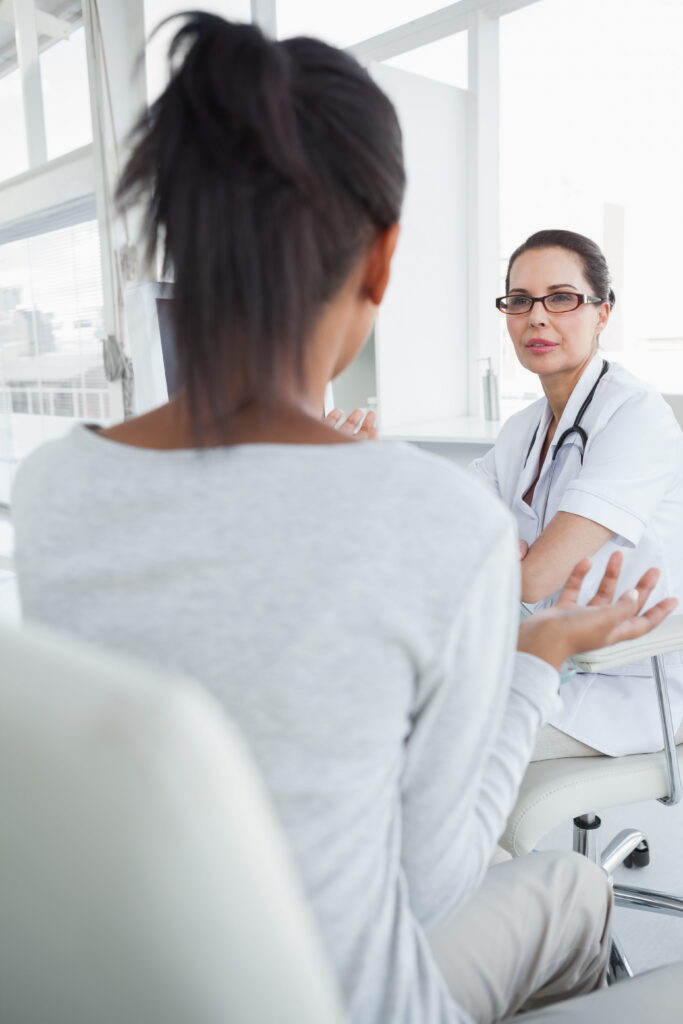 A woman talks to her doctor about starting Adderall Addiction Treatment in Hanover.