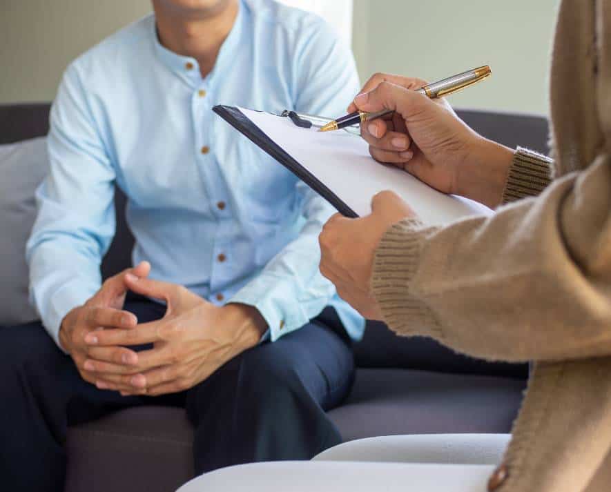 Therapist working with a client during Adderall addiction treatment in Hanover.