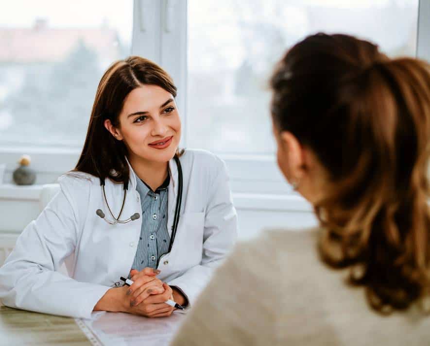 Medical professional guiding a patient in a clinic for Adderall addiction treatment in Hanover.