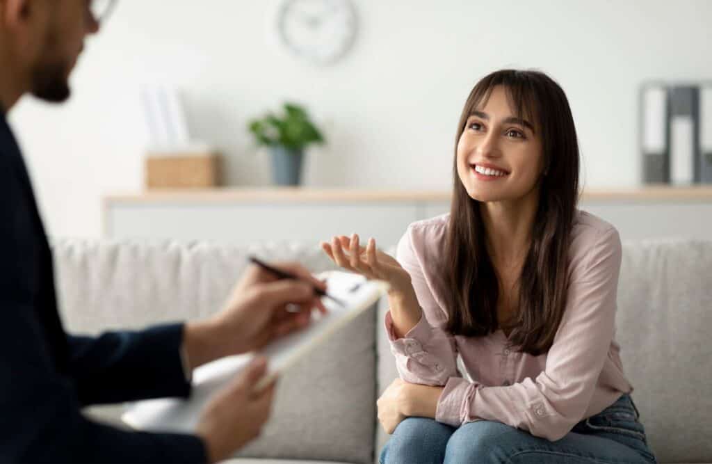 Woman speaking with a counselor during benzodiazepine addiction treatment in Hanover.