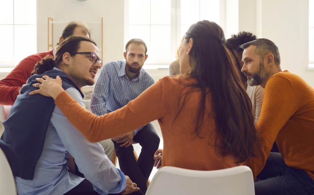 Clients participating in group therapy during opioid addiction treatment in Hanover.