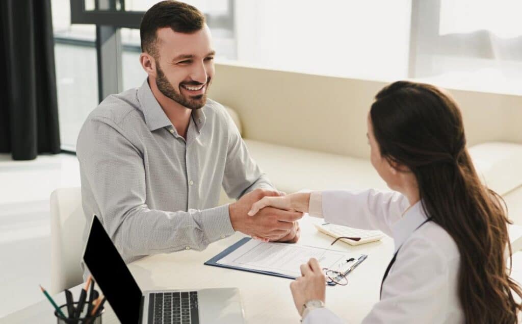 Man meeting with a clinician to begin drug rehab in Hanover, MA.