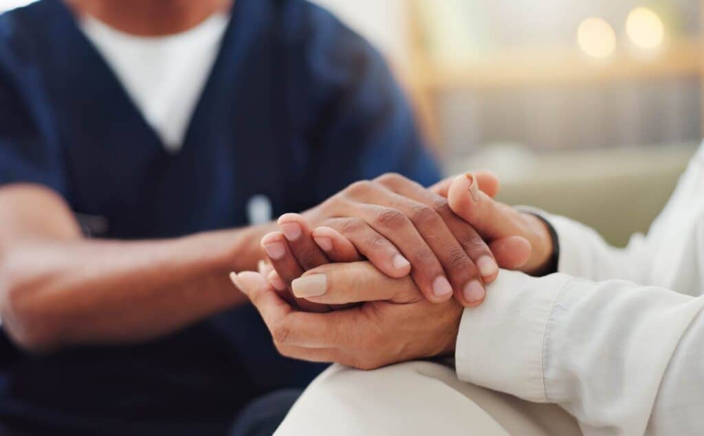 Physician providing support to client during opioid addiction treatment in Hanover.