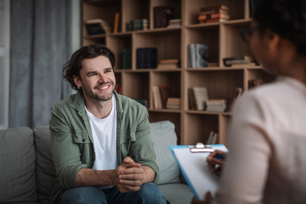 Man consulting with a psychologist during medication management for addiction in Hanover, MA.