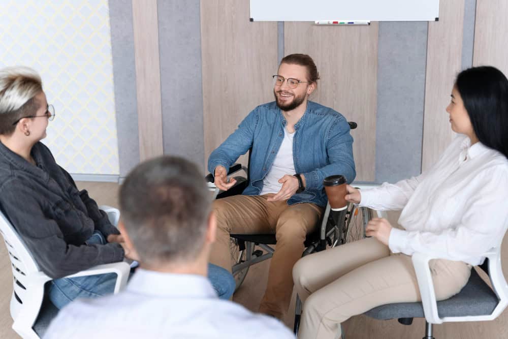 Team members connecting in a supportive professional environment at Brook Addiction Treatment Center in Boston, MA.