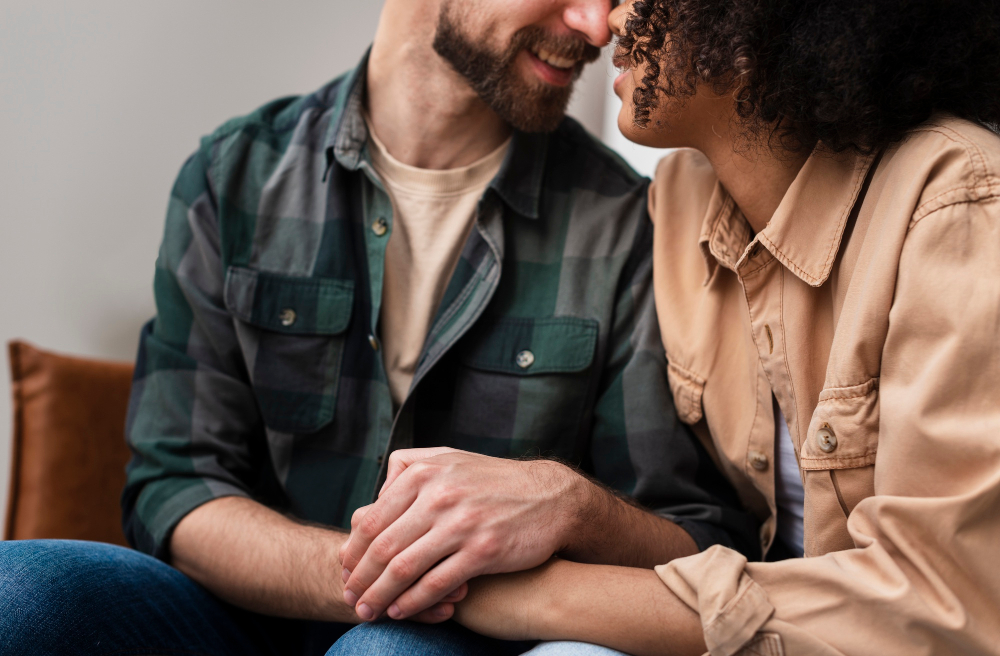 Man holding a woman's hands, representing how to support someone in rehab.